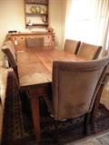 Vintage hand hewn and pegged farm table, 7 ft long.  Shown with six matching suede Parson chairs.
