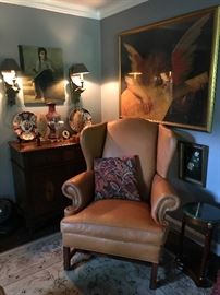 A butter leather wing chair,  mahogany  chest, antique Imari, oil paintings, a large angel print, and a pair of Chapman wall hanging light fixtures