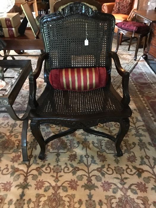  One of a pair of vintage French lacquered and cained chairs 