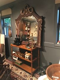 Three shelved  console from Nell Hills 
Large decorative Arts mirror in a antiqued frame