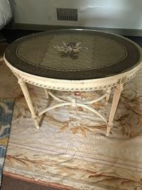 Small oval table that belongs to the bedroom set.