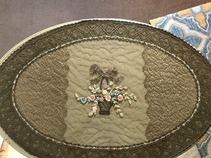 This is a close up of the woven textile for a small oval table that goes with the set.