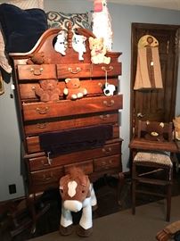 The children's room. A vintage chest with pillows,  A collection of antique teddy bears, and a Pottery Barn pony.