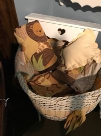 And Antique crib filled with the makings of a dressed crib for a baby boy.