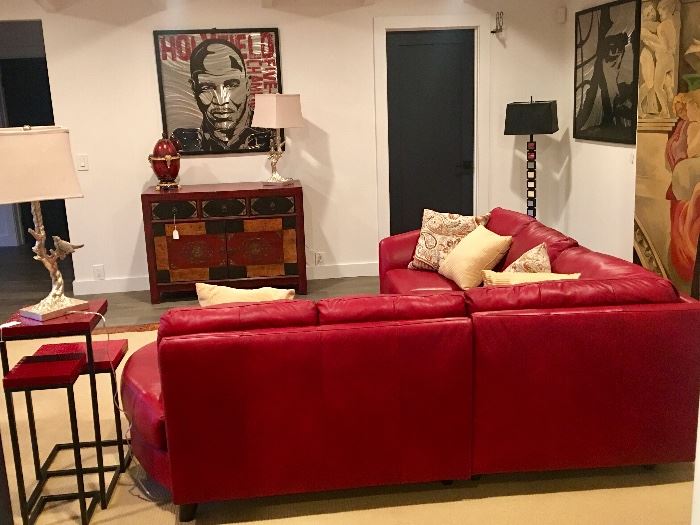 Red leather sectional sofa on crocodile border area rug, silverleaf bird lamps, media cabinet 