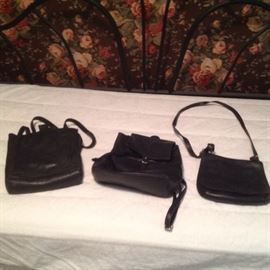 Leather black purses and backpack.  Two are coach.