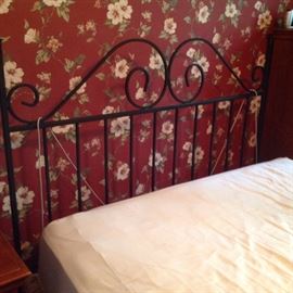 Wrought iron queen headboard.. $65.  60" wide and 52" tall.  Mattress and box spring too.