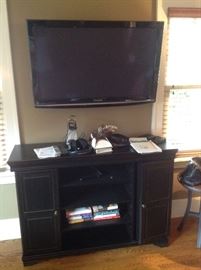 Black console or tv stand...50" long, 36" tall and 15" wide,  $125...... Presale available...also flat screen tv for $125