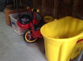 Child tricycle with 2 helmets, Rubbermaid bucket for mopping, mop also