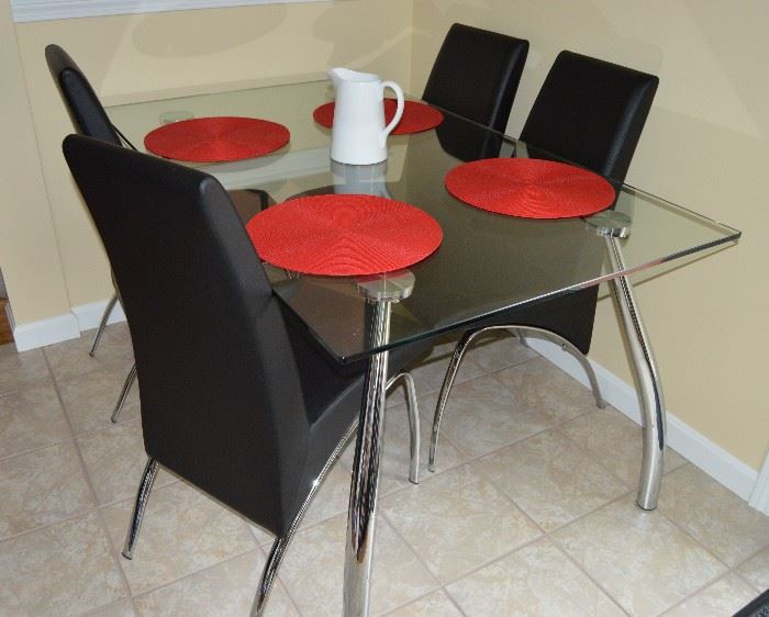 Glass on Chrome Dining table with Mensa black chairs