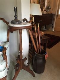 Canes and larger pottery vase