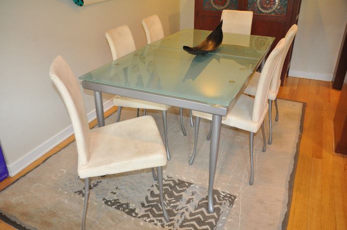 Exquisite expandable Arkitekura chrome and satin glass contemporary dining table with 6 chrome and suede dining chairs! Closed size is 65"w x 35.5