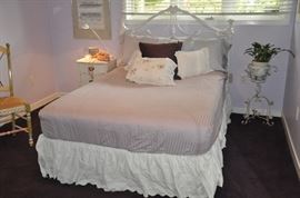 Fantastic full size white scrolled metal headboard. Shown with a full size Serta bed. 