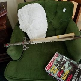 Decorative sword, Roman warrior cameo plaque, Green chair, WWII magazines