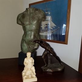 Male nude statues of various materials