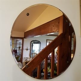The object of this photo is the round beveled mirror from the Art Deco era...it has a pink tint to the glass, but that isn't very obvious in this photo....   