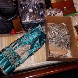 Costume items?  Box contains metalic thread fringe