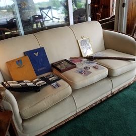 Vintage sofa displaying Chet Luders' military items