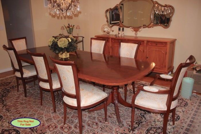 Quality Wood Dining Table with Eight Chairs. The Table and Chairs are In Excellent Condition and the Chairs have a Beautiful White/Gold Delicate Print