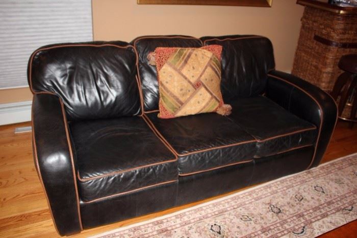 Leather Sectional with Accent Pillow