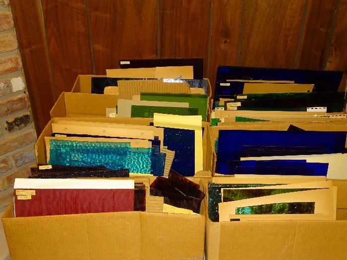 Boxes of colored glass panels for stained glass
