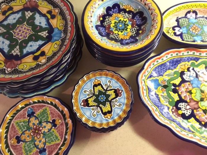 Various colorful plates, servers and bowls, all micro/oven safe, signed Hernandez Talavera, Puebla, Mexico