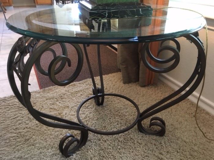 Wrought-iron side table with round glass top