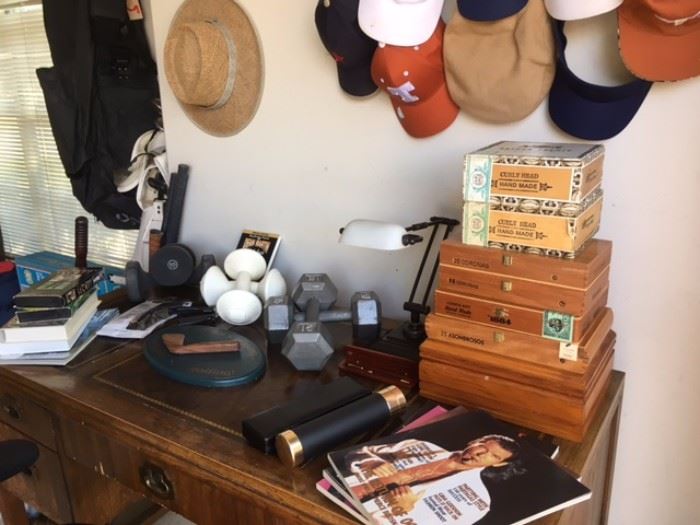 Assorted empty cigar boxes, airtight containers, Smoke magazine, golf & sun hats, wool caps, UT caps, hand weights