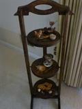 Three tiered display holder with knick knacks.