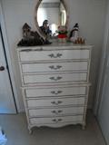 Tall chest of drawers that are in the bedroom set including a bed, nightstand and a vanity for $200.00