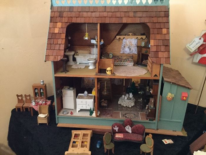 Doll House front where you get to play, so much furniture we have separated some out but basics all come with house