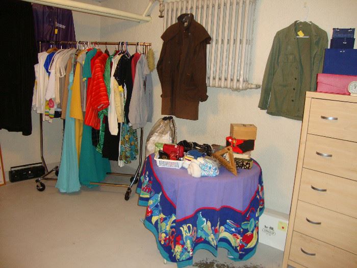 Variety of men's and women's clothes including suites, coats, and Driza-Bone men's jacket and woman's coat