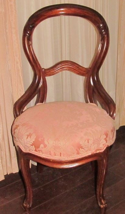 A Rococo Revival-Style Side Chair. Balloon-back with Curved Braces, Cabriole Front Legs and Flared Back Legs.  The Rounded Seat is Upholstered in a Pink Brocade