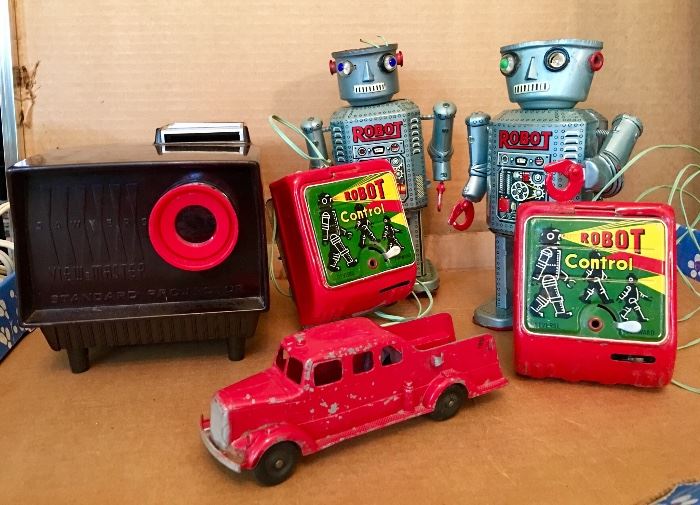 Antique tin robots, metal cars, film and slide projectors