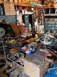 Tools including primitives, boxes of nails, screws, large staples, tarps