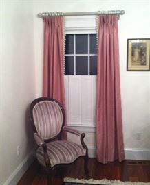 Parlor chairs and mauve silk drapes