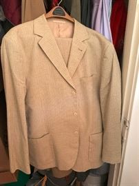 Several nice men's suits and clothing.