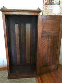 There is a rack on the top of the cabinet for hanging clothes.
