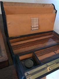 Close up of inside showing wood lining and ink bottle.