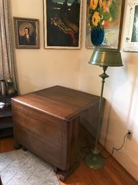 Beautiful solid oak gate leg table. Includes custom made pads to protect the top of table. This is a real space saver in smaller homes. Would make a wonderful sofa table and then an extra serving table when needed.