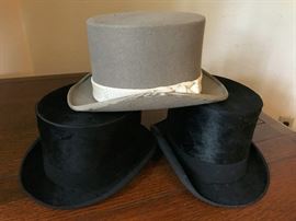 These old top hats are wonderful! All from England. We believe the black ones are made from beaver.