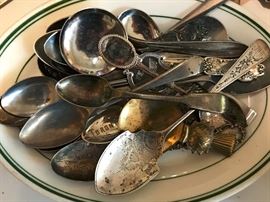 Several small antique spoons. Many are sterling silver.