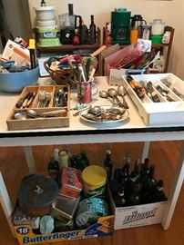 LOTS of silverware to pick from. Also, several tins and empty wine bottles for gardening projects. Several small appliances also available.