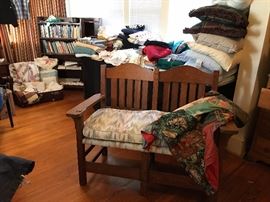 Sturdy bench that was used at the end of the bed. Lots of towels, bedding and table cloths available. There is a big stack of linen tablecloths that would be great to use for vintage crafts!