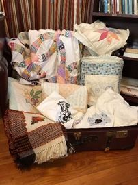 Nice quilt tops and embroidered items.