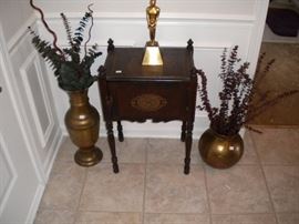 Smoking cabinet and brass vases. 