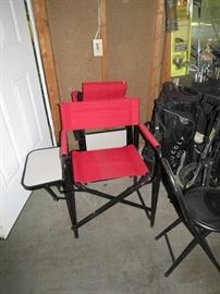 2 folding chairs with side tables.