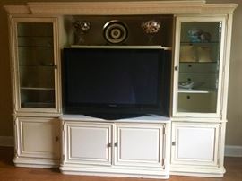 Stanley Entertainment Center with Ivory Burl Wood,  lights, glass shelves and cabinets