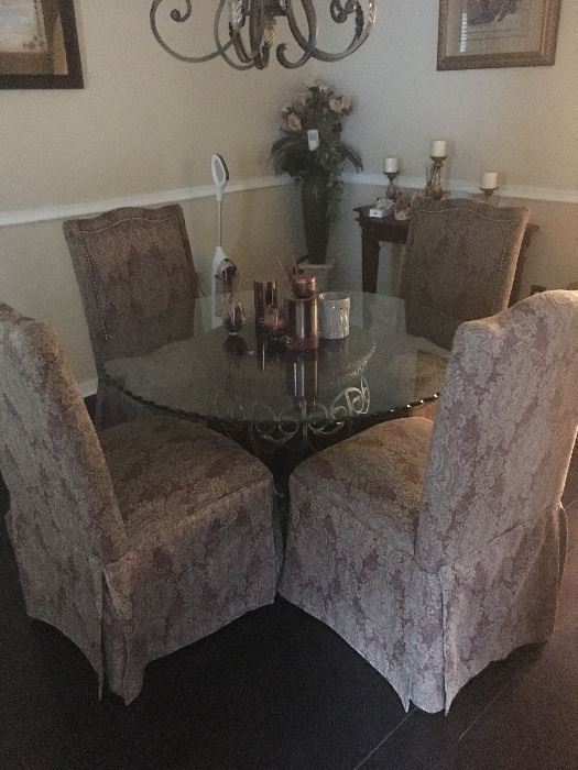 Fabric chairs and round glass top table