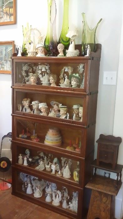 5 STACK GLOBE WERNICKE OAK BOOKCASE filled with VINTAGE LADY HEAD VASES, WEDDING CAKE TOP DECORATIONS, VIKING GLASS VASES